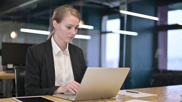 istock Young Businesswoman Working on Laptop in Office 1344958505