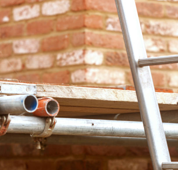 istock Building  project or renovation, construction with scaffolding and ladder 1344958751