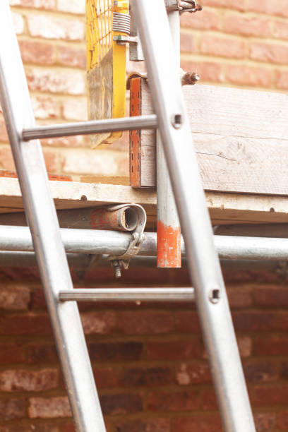 istock Building  project or renovation, construction with scaffolding and ladder 1344958756