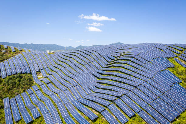 Aerial shot of a solar photovoltaic plant on a mountaintop Aerial view of the solar power plant on the top of the mountain low carbon economy stock pictures, royalty-free photos & images