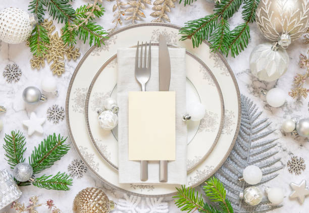 istock Festive table setting of with fir tree branches and Christmas decorations 1344961848