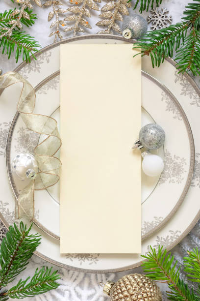 istock Festive table setting of with fir tree branches and Christmas decorations. Menu mockup 1344961852