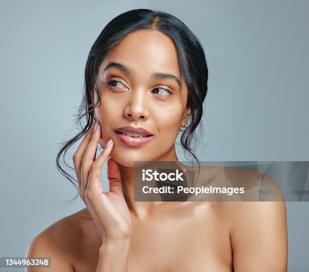 istock Studio shot of an attractive young woman posing against a grey background 1344963248