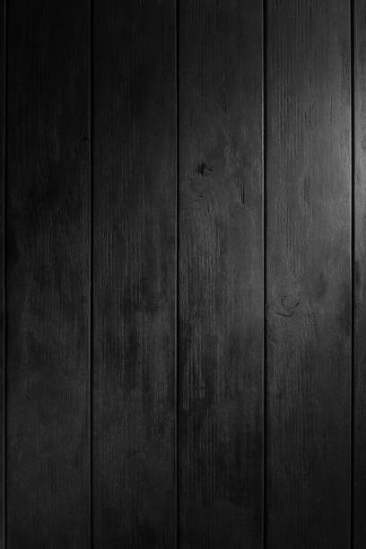 istock Black wooden table detail. Background or texture. Wooden table texture to add your text. Rustic textures concept to add your design 1344963780