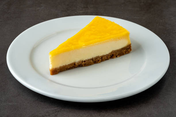 istock Delicious lemon cheesecake on black stone table 1344964662