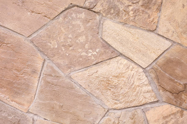 textura de un muro de piedra. fondo beige. textura de piedra natural. - seam horizontal full frame outdoors fotografías e imágenes de stock