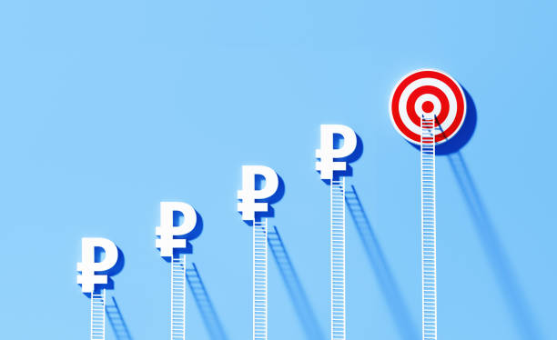 istock White Ladders Leaning Onto Ruble Signs And Bull's Eye Target on Blue Wall 1344967413