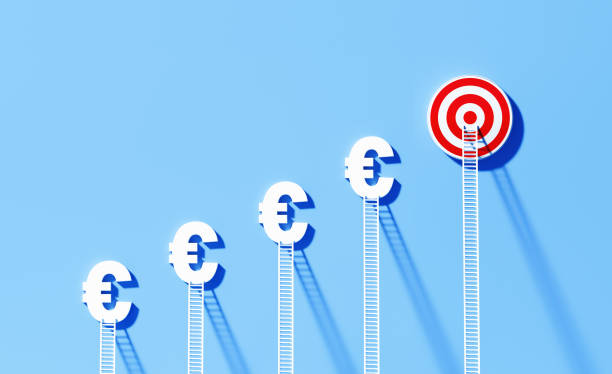 istock White Ladders Leaning Onto Euro Symbols And Bull's Eye Target on Blue Wall 1344968945