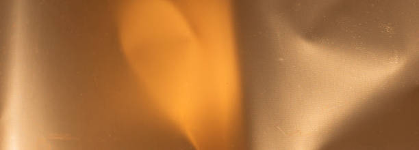istock crinkled gold foil with visible details. background or texture 1344970540