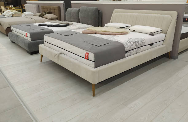 modern luxury beds in the mall. furniture store. sale of beds and sofas.sale, discounts - bedding merchandise market textile imagens e fotografias de stock