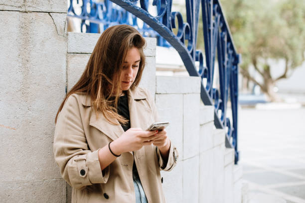 istock Young woman using a smart phone 1344972070