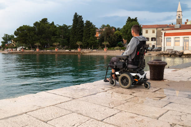 istock Wheelchair at sunset in sea 1344974766