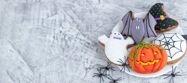 istock banner with delicious halloween cookies on white textured concrete 1344975015