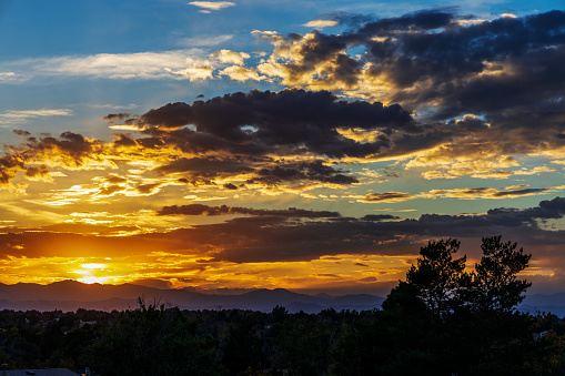 Sunset skies in the fall over the suburban neighborhood in Aurora, Colorado