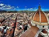 the view of florence, italy and the cattedrale di santa maria del fiore (duomo di firenze) from atop giotto’s campanile (bell tower).
