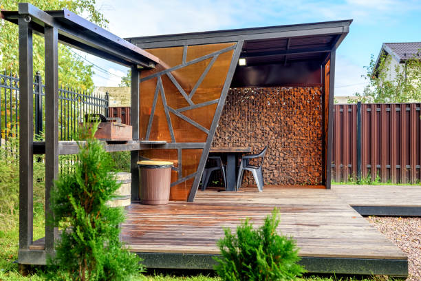 istock Picnic area with barbecue grill and table and chairs 1344976517