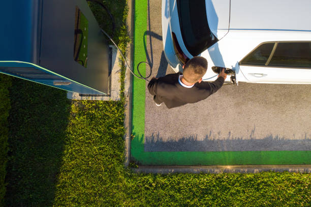 istock Man charging an electric car 1344977073