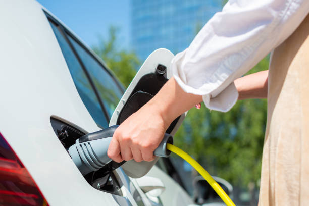 istock Electric car charge in a downtown 1344977128