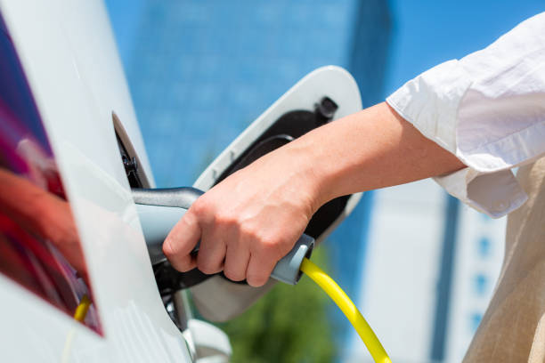 istock Unplugging the electric car charger 1344977154