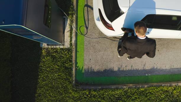 istock Man charging an electric car 1344977293