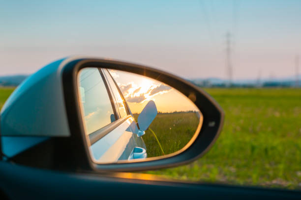 istock Electric car charge in a rear mirror 1344977875