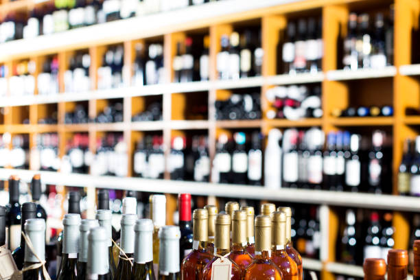 istock View on supermarket shelves with wine bottles 1344978614