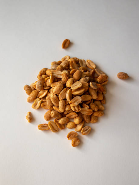 istock Roasted chili lemon peanuts on a white background 1344978800