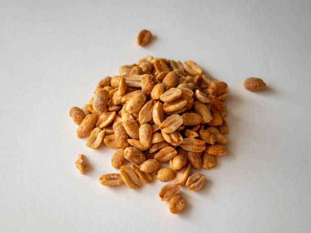 istock Roasted chili lemon peanuts on a white background 1344978815