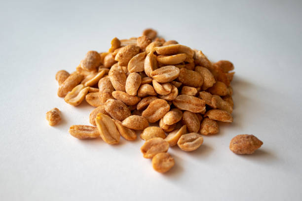 istock Roasted chili lemon peanuts on a white background 1344978916