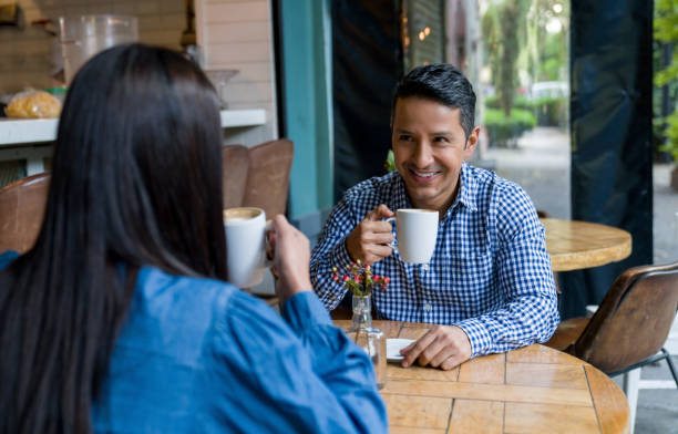 istock Happy man on a date at a cafe and drinking a cup of coffee 1344979176
