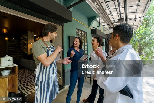 istock Successful team in a motivational meeting at a restaurant 1344979759