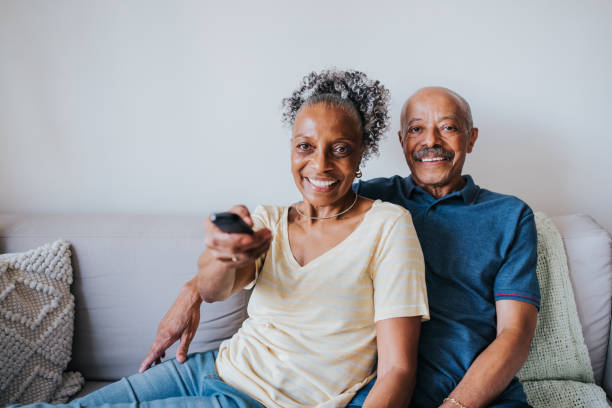 istock Senior couple watching tv 1344980755