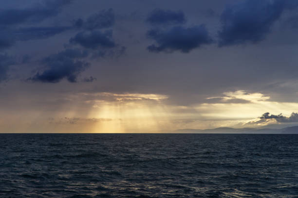istock the setting sun shines through the clouds over the Black Sea 1344981377