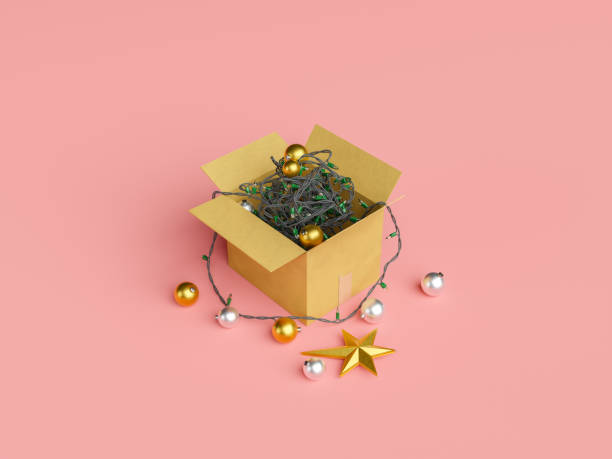 cardboard box filled with tangled christmas lights and ornament cardboard box filled with tangled christmas lights and ornament balls. christmas decoration concept. christmas arrival. 3d rendering christmas decoration storage stock pictures, royalty-free photos & images