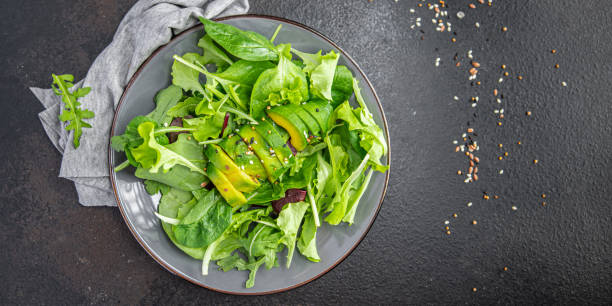istock fresh salad avocado leaf mix lettuce, spinach, arugula, chard, lettuce meal snack on the table copy space food background rustic 1344984102