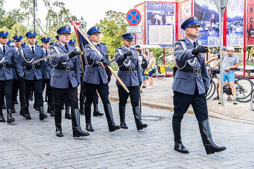 Warsaw, Poland - September 1, 2018: Military parade of soldiers in Krakowskie Przedmiescie in the old town of Warsaw, Poland