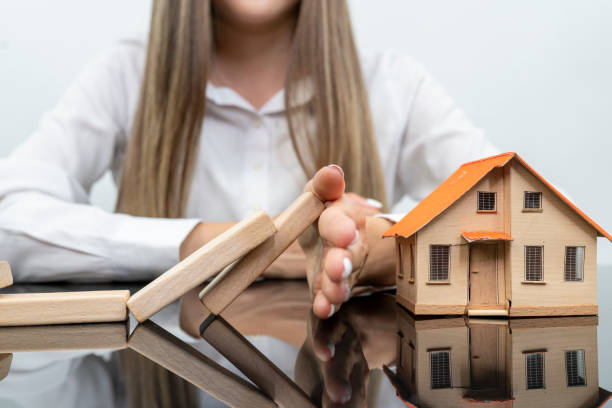 Hands of business woman stop block a wood game, gambling placing a wooden block. Concept Risk of management and strategy plan, protect business to success. Hands of business woman stop block a wood game, gambling placing a wooden block. Concept Risk of management and strategy plan, protect business to success. marital property divorce stock pictures, royalty-free photos & images