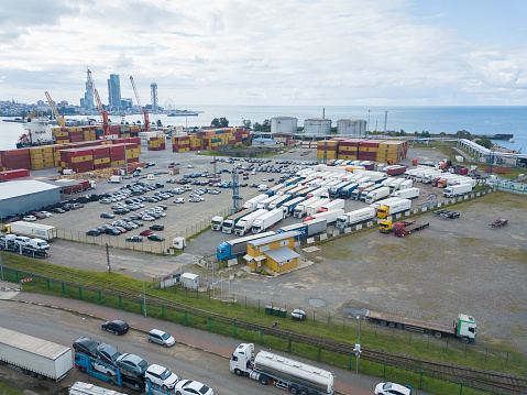 Batumi, Georgia - September 5 2021: Drone view of the parking lot of cars, trucks in the port of Batumi on a summer day