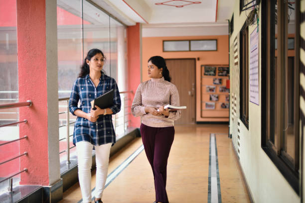 istock Teachers walking through Indian School Corridor in a school 1344991354