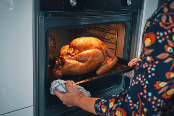 istock Roasting Turkey in the Oven for Holiday Dinner 1344997145