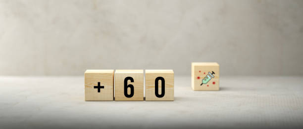 istock cubes with message +60 and syringe symbol - 3d illustration 1345002923