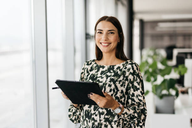 istock Good-looking business woman smiling 1345003051