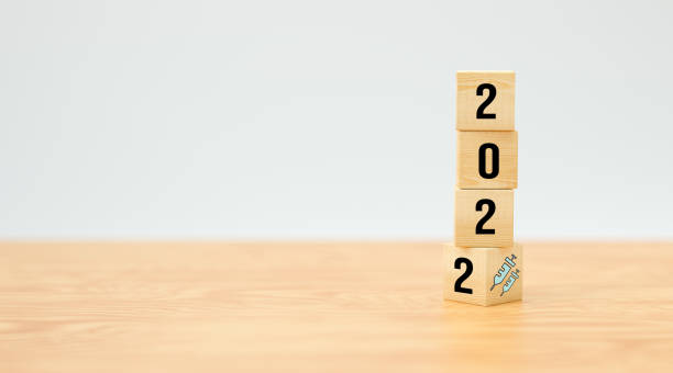 istock cubes with number 2022 and vaccination symbol - 3d illustration 1345003991