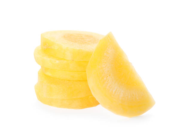 istock Slices of raw yellow carrot isolated on white 1345004414