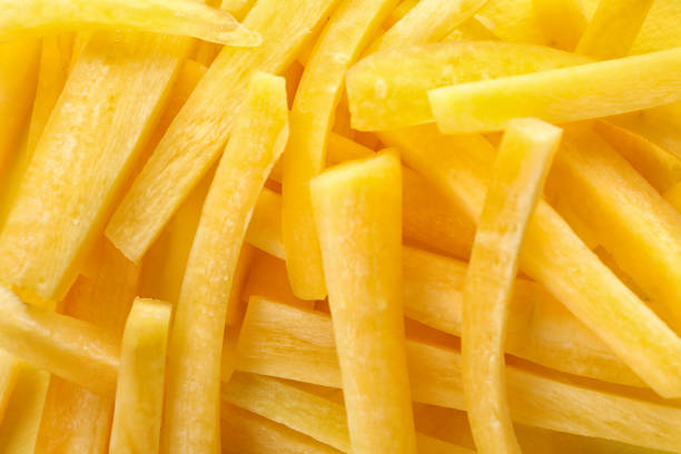istock Raw yellow carrot sticks as background, closeup 1345005988
