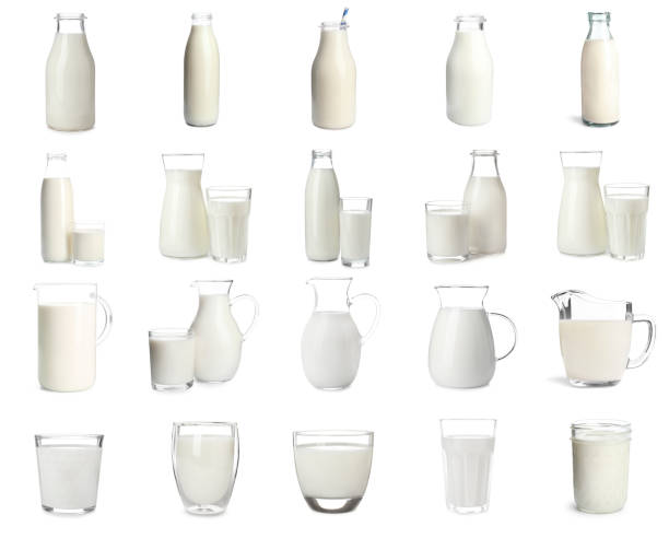 Set with different glassware of fresh milk on white background