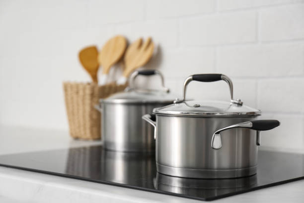 istock New saucepots on induction stove in kitchen 1345008637