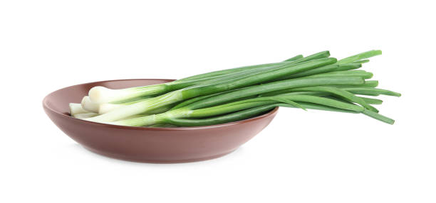 istock Fresh green spring onions isolated on white 1345009338