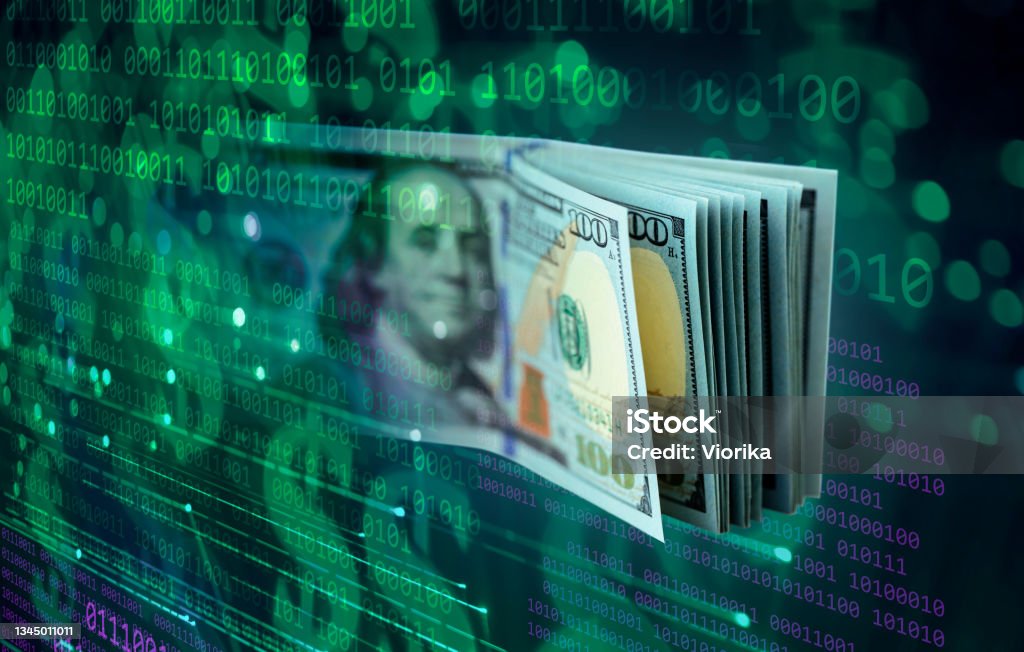 Financial Technologies - binary code background with dollar banknotes Binary code abstract background with US $100 dollar banknotes. Shallow depth of field. US Paper Currency Stock Photo