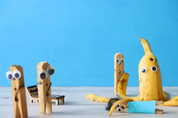 Stock photo showing a close-up view of ripe banana made into cartoon octopus with googly eyes and peel tentacles for a touch of humour. Fun way to encourage healthy eating in children.